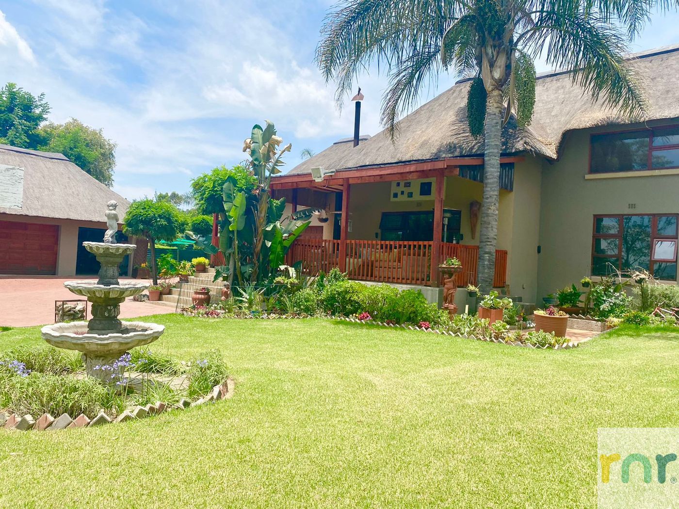 A Spacious farm style Home with Beautiful Gardens